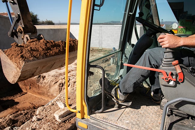 Excavator digging safely